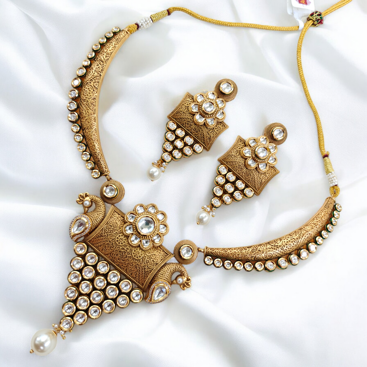 Royal Kundan Studded Hansli Set with Fine Carvings.