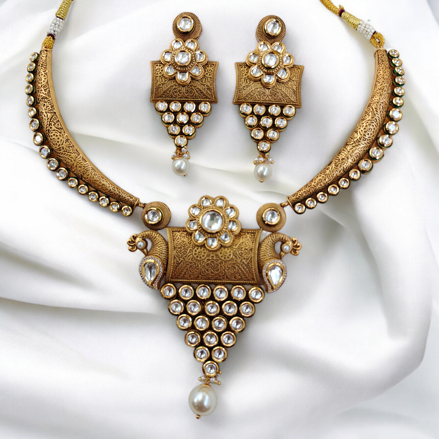 Royal Kundan Studded Hansli Set with Fine Carvings.